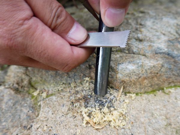 How to start a fire with FERROFIRE fire starter. Step 2. Remove coating.